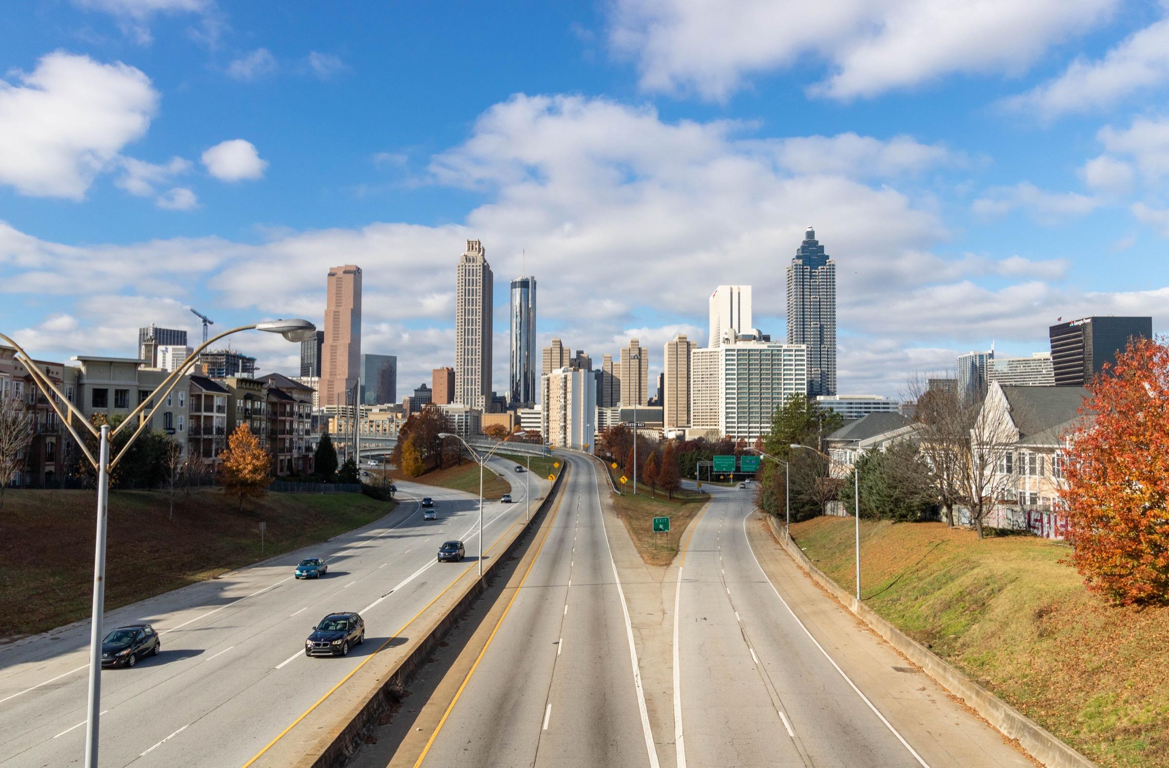 Atlanta skyline beyond a divided highway
