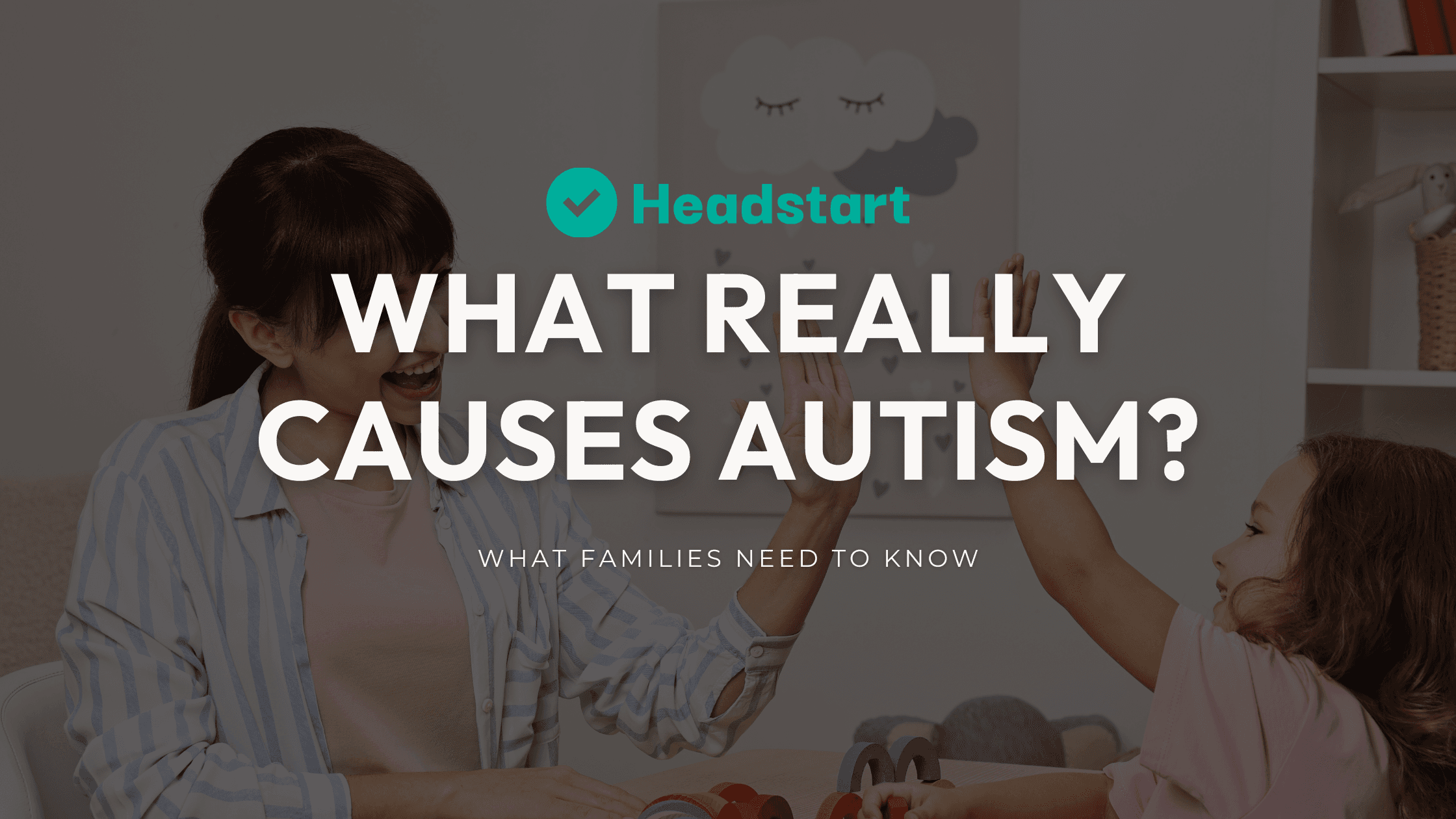Parent and child high-fiving beneath the words What really causes autism?