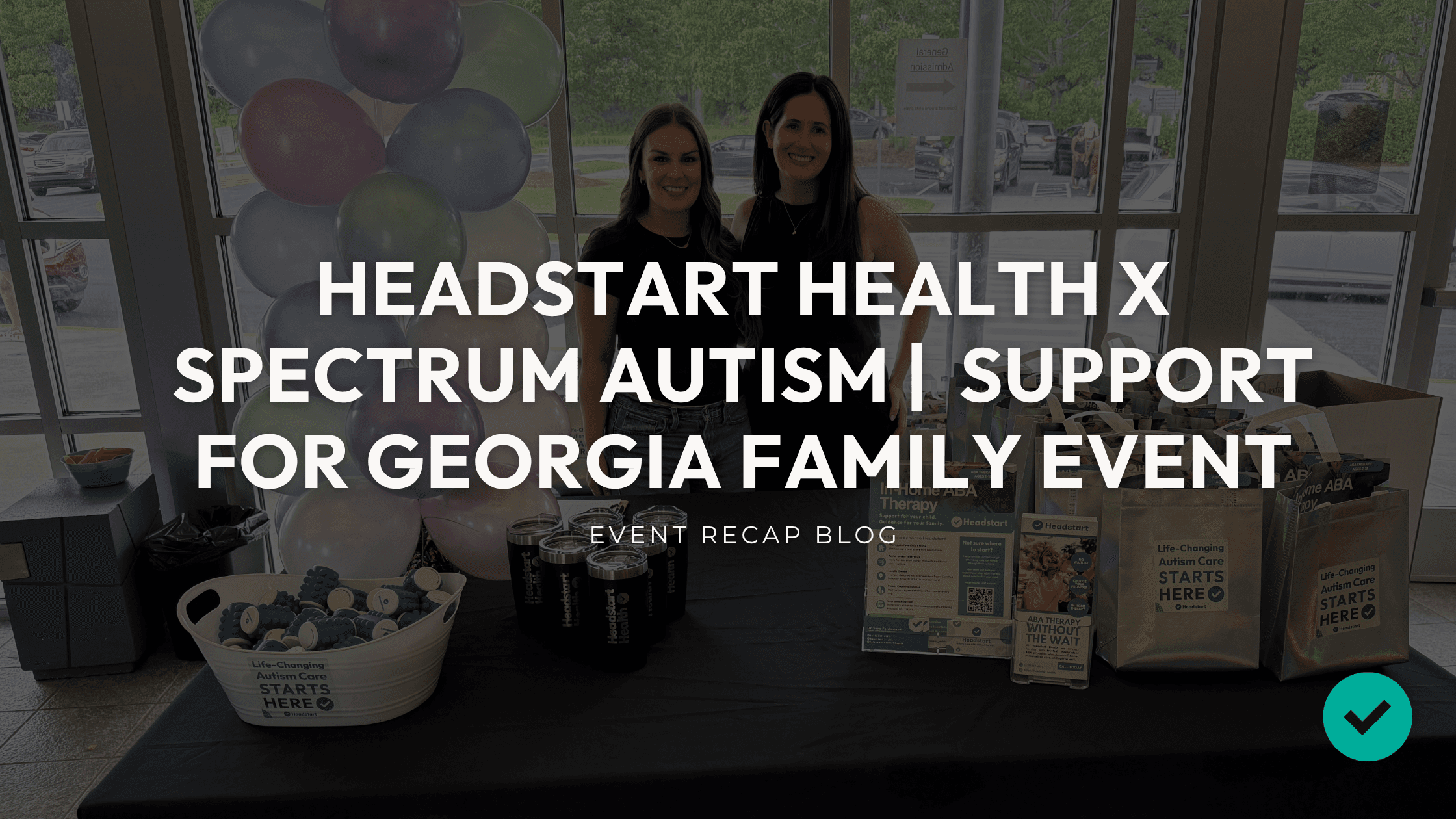 Two Headstart team members at a Spectrum Autism Support event display
